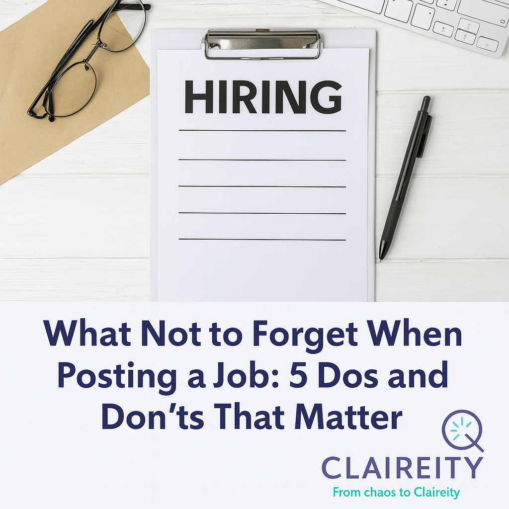 Image of desk with hiring note on a clipboard, a pen and glasses